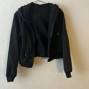 Pretty black hooded sweatshirt for children. It’s new, never worn and soft
